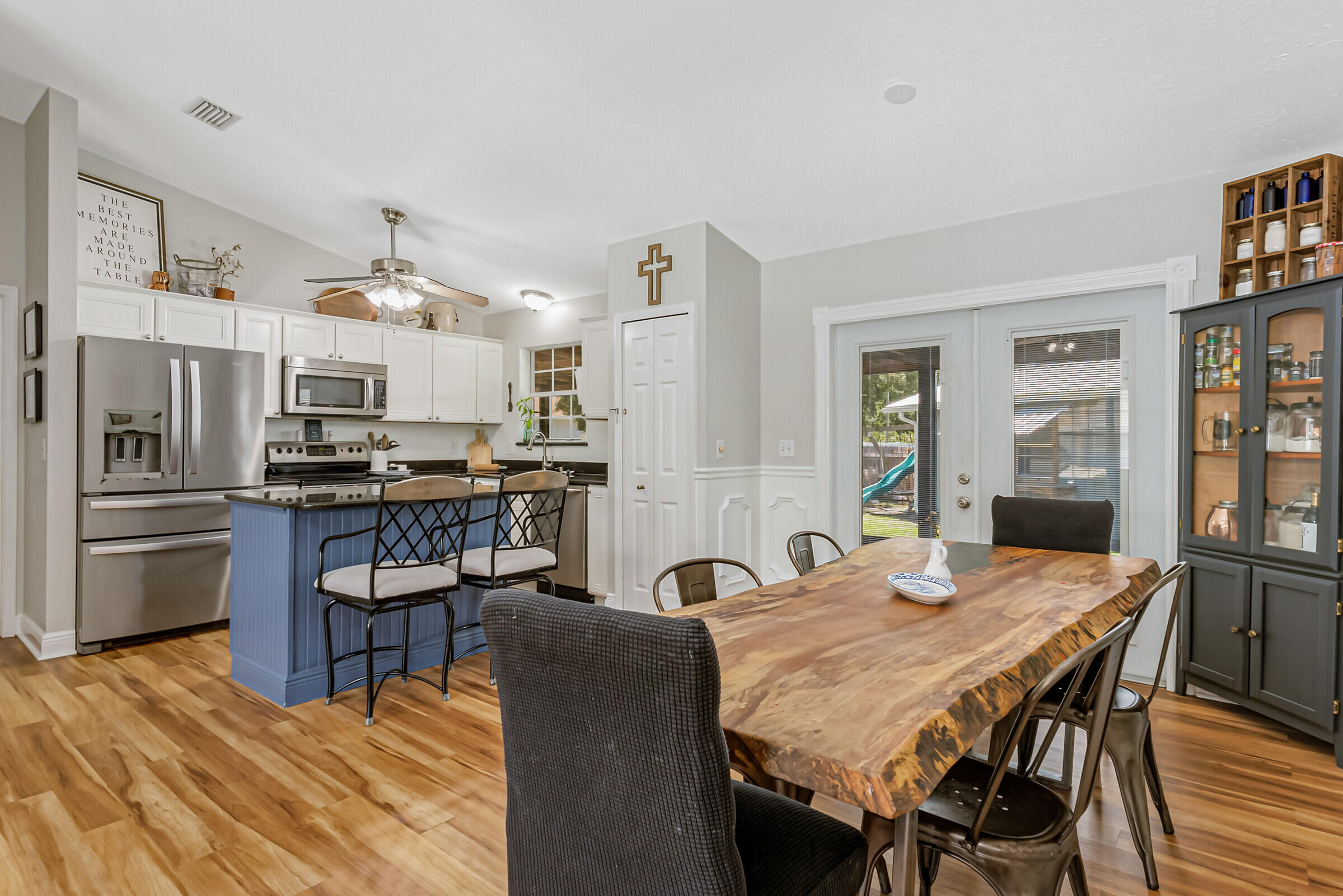1030 San Rafael Road Southwest Palm Bay, FL 32908 - Photo 6 of 37 a view of a dining room with furniture and wooden floor