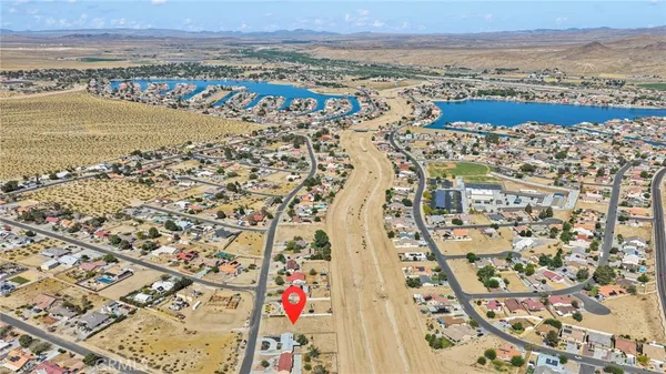an aerial view of residential building and ocean view