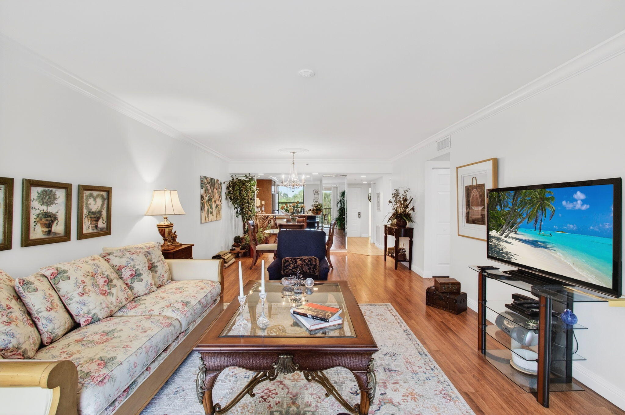 6562 Boca Del Mar Drive, Unit 326 Boca Raton, FL 33433 - Photo 8 of 25 a living room with furniture and a flat screen tv