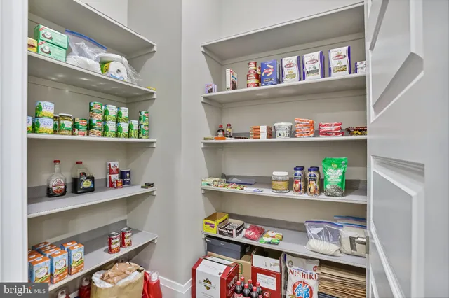 a view of a livingroom with furniture and a window
