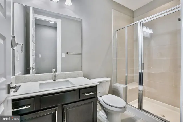 a bathroom with a glass shower door