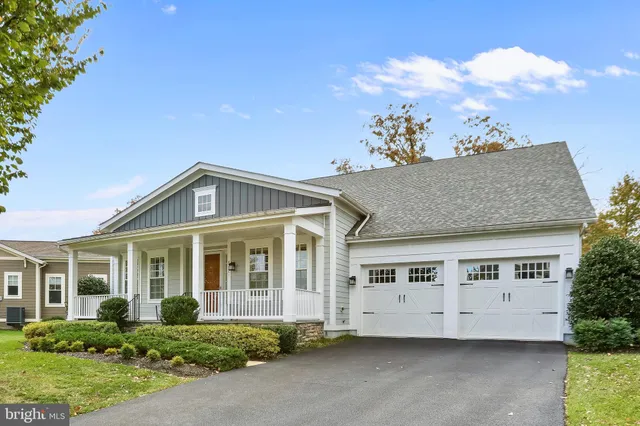 front view of a house with a garden