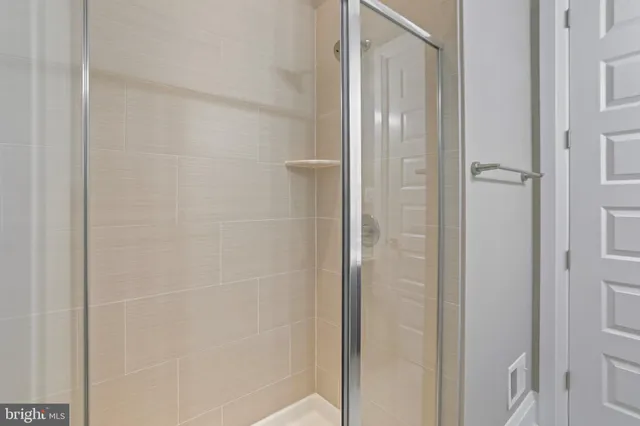 a view of room with cabinet and a flat screen tv