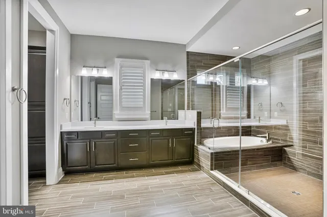 a bathroom with a bathtub and a shower