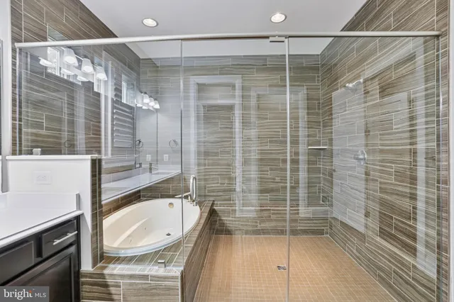 a spacious bedroom with a bed and a large window