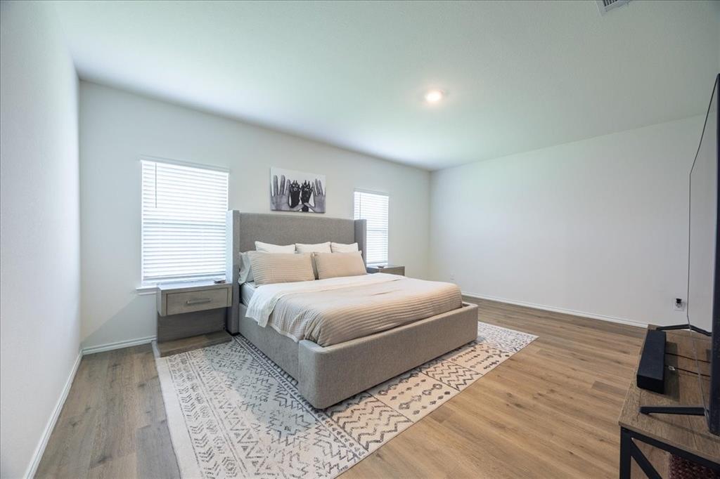 729 Amelia Court Pilot Point, TX 76258 - Photo 19 of 40 Primary bedroom on the main floor