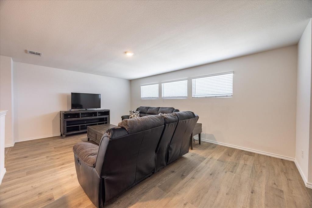 729 Amelia Court Pilot Point, TX 76258 - Photo 26 of 40 Living area upstairs