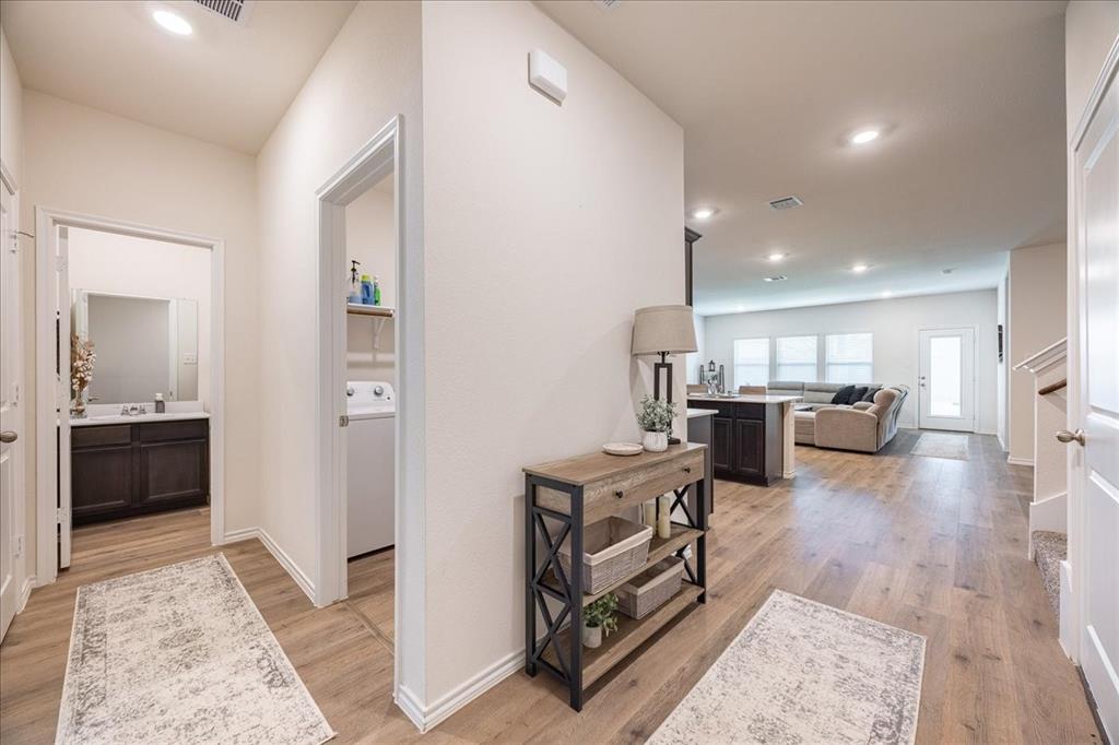 729 Amelia Court Pilot Point, TX 76258 - Photo 3 of 40 Full guest bath and laundry on main floor.