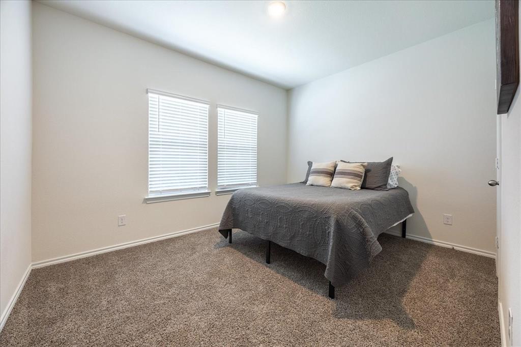 729 Amelia Court Pilot Point, TX 76258 - Photo 7 of 40 Guest bedroom 1 main floor
