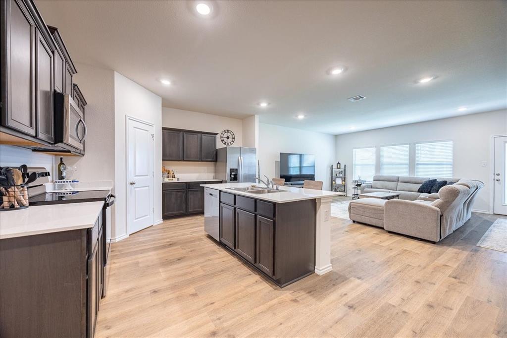 729 Amelia Court Pilot Point, TX 76258 - Photo 39 of 40 Open floor plan from kitchen to the main living area