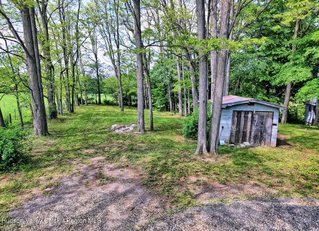 a kitchen with a sink cabinets and window