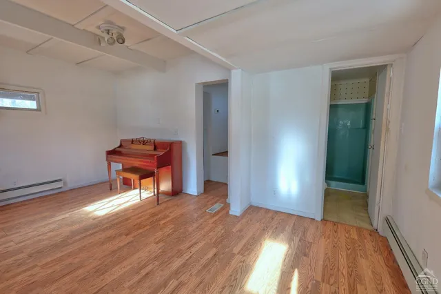 a kitchen with refrigerator and window