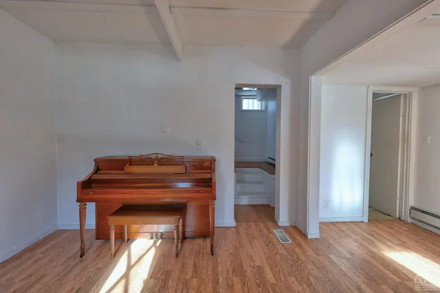 a view of a dining room with furniture large window and outside view
