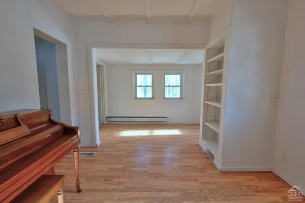 a view of an empty room with a window