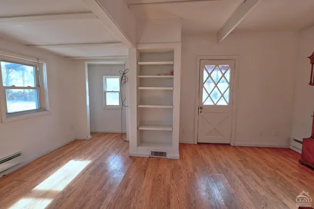 a view of a room that has a window in it