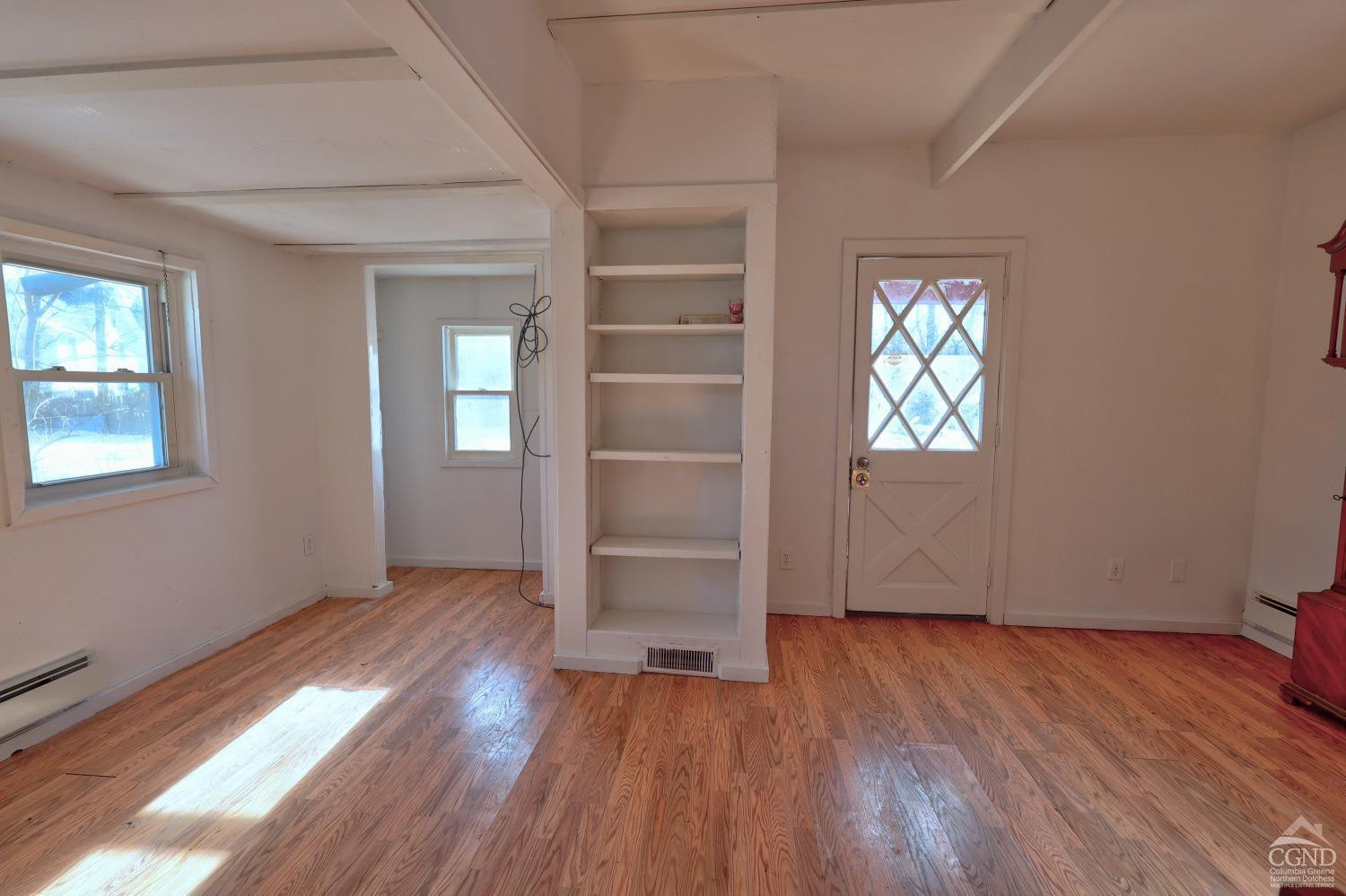 360 Stone Bridge Rd Extension East Durham, NY 12423 - Photo 23 of 83 an empty room with wooden floor closet and windows