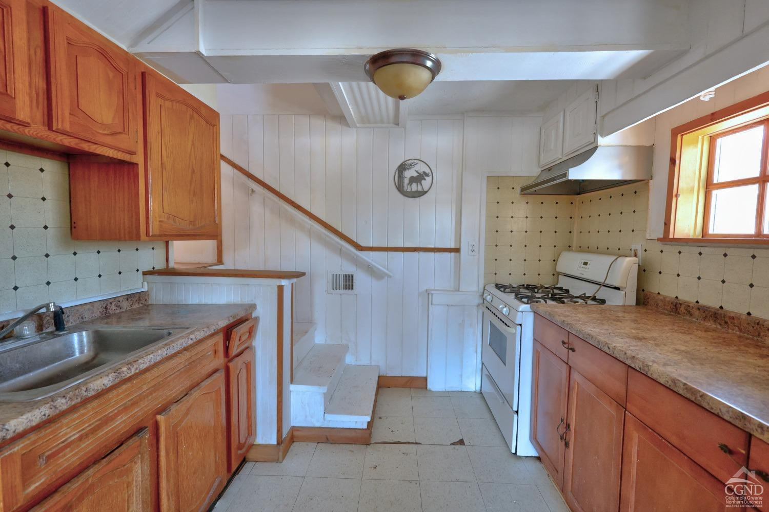 360 Stone Bridge Rd Extension East Durham, NY 12423 - Photo 24 of 83 a kitchen with a sink and a refrigerator