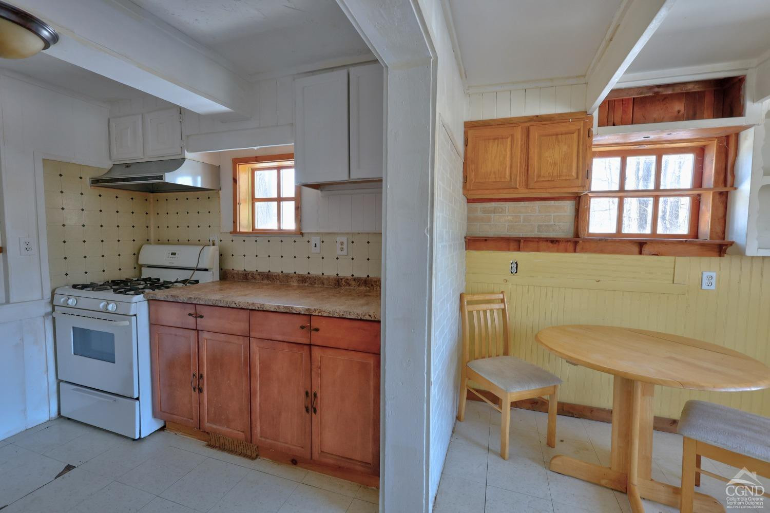 360 Stone Bridge Rd Extension East Durham, NY 12423 - Photo 26 of 83 a kitchen with a sink cabinets and window