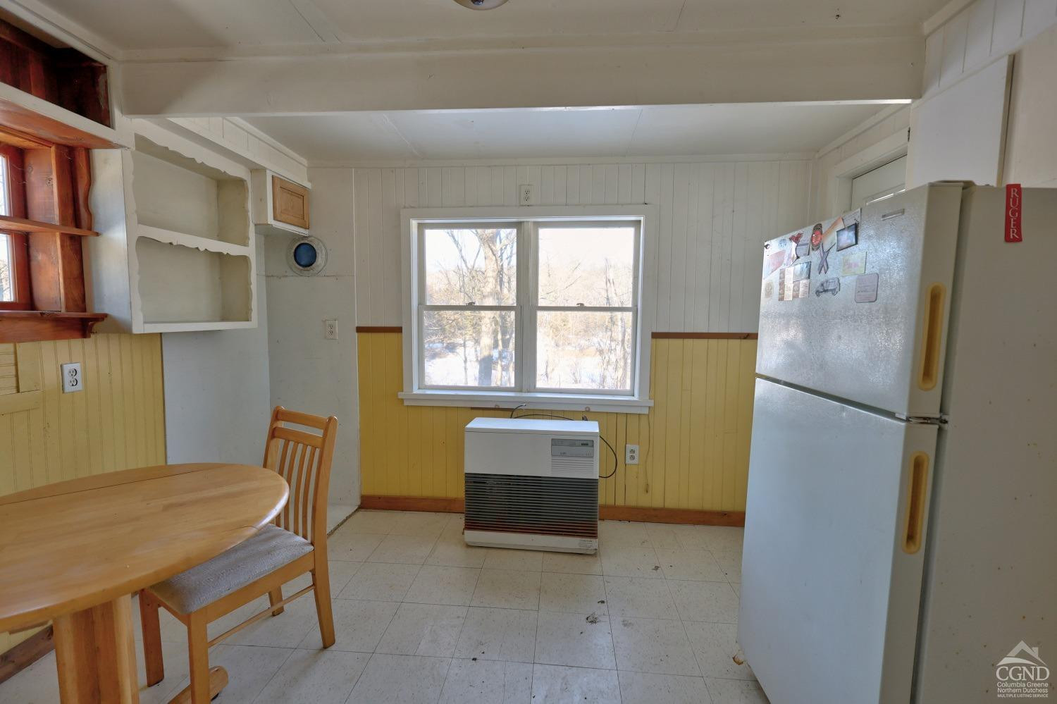 360 Stone Bridge Rd Extension East Durham, NY 12423 - Photo 30 of 83 a kitchen with refrigerator and window