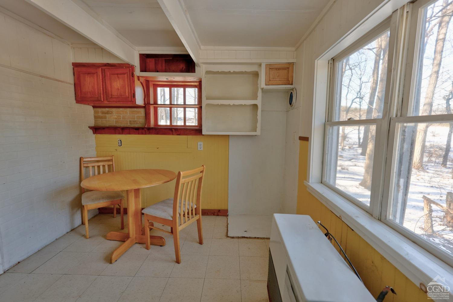 360 Stone Bridge Rd Extension East Durham, NY 12423 - Photo 31 of 83 a view of a dining room with furniture large window and outside view