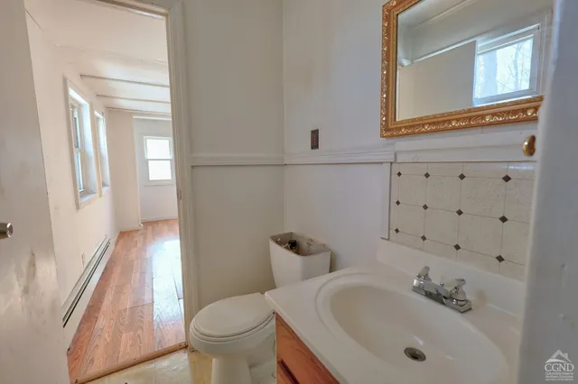 a backyard of a house with lots of green space and fountain