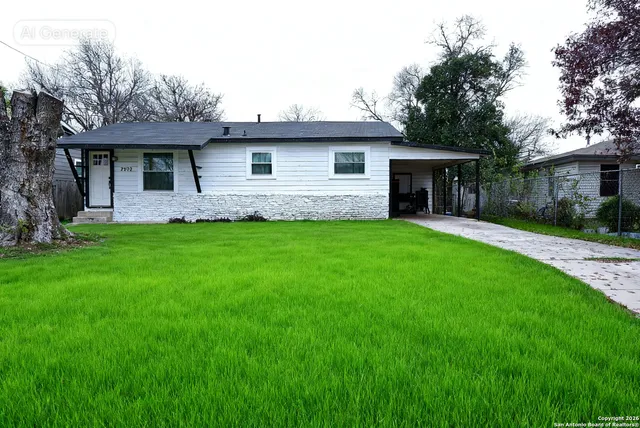 a front view of a house with a garden and yard