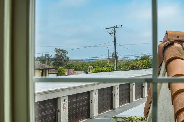 a view of a balcony with furniture