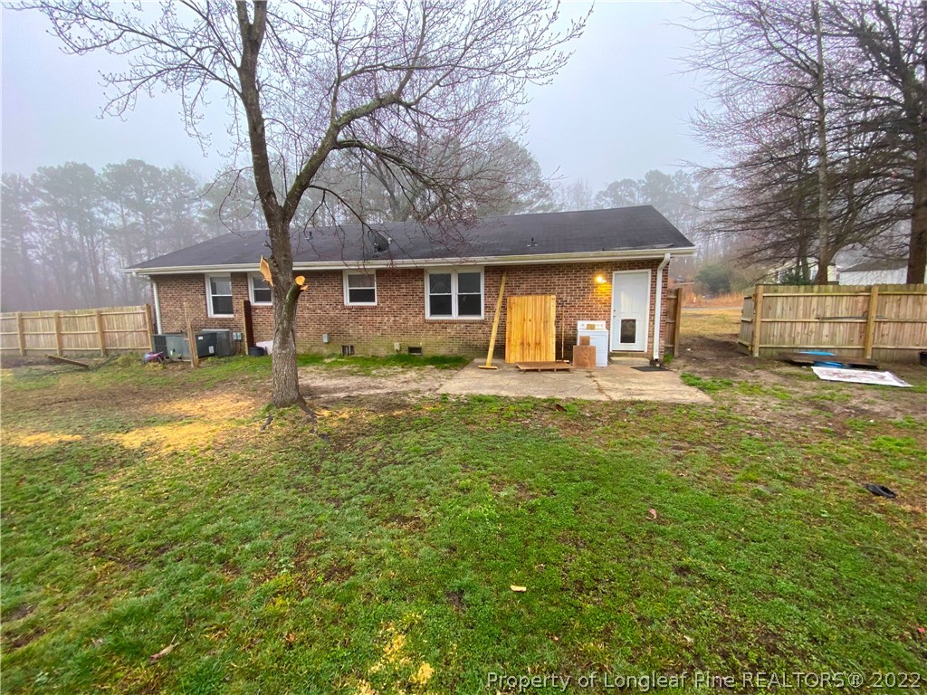 269 Azalea Drive Spring Lake, NC 28390 - Photo 12 of 13 a house view with swimming pool in front of it