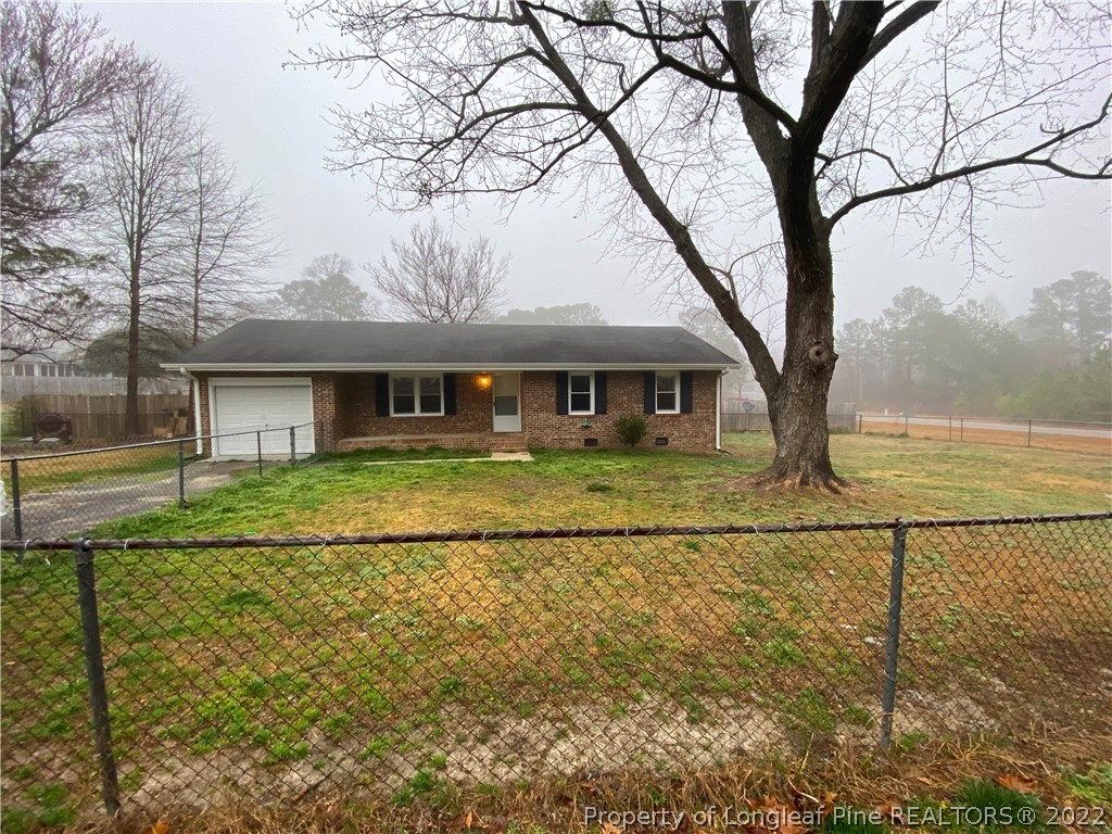 269 Azalea Drive Spring Lake, NC 28390 - Photo 2 of 13 a front view of a house with a yard