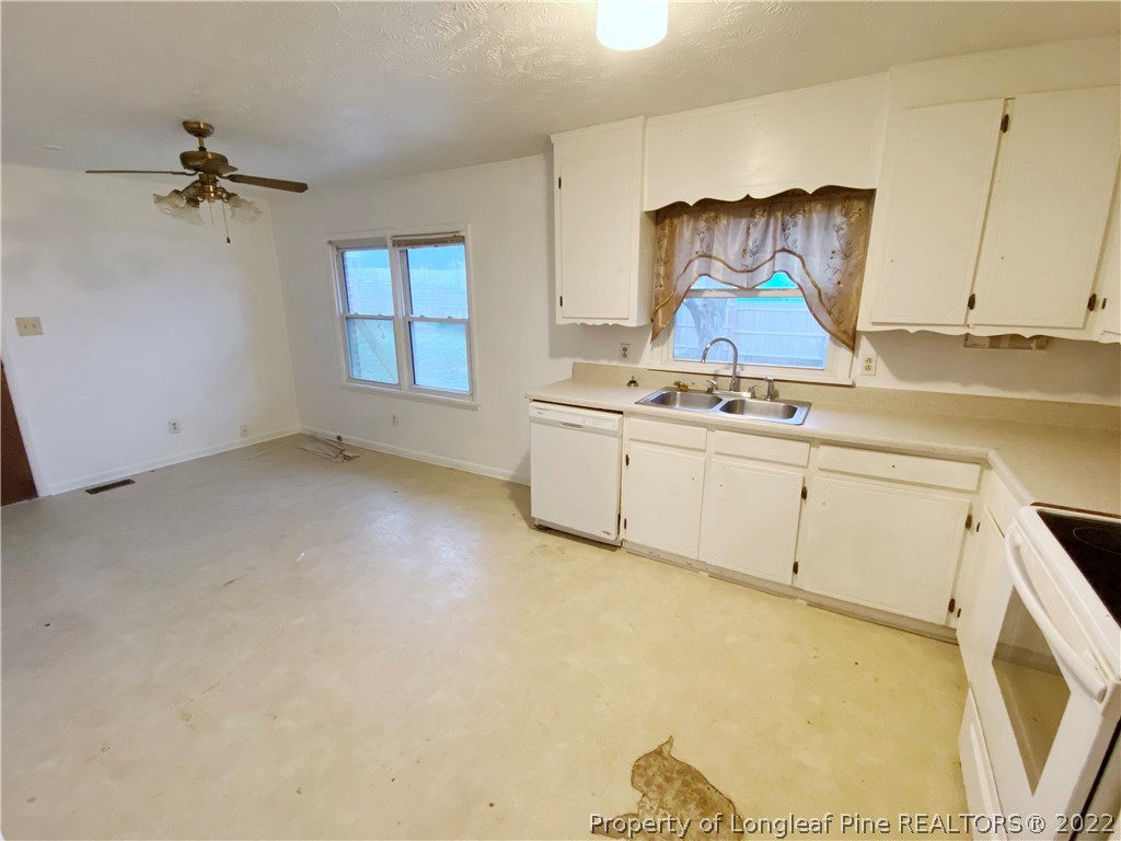 269 Azalea Drive Spring Lake, NC 28390 - Photo 4 of 13 a room with a stove a sink and a window