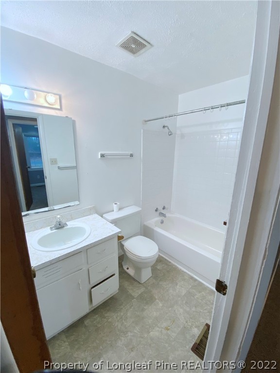 269 Azalea Drive Spring Lake, NC 28390 - Photo 7 of 13 a bathroom with a sink a toilet and shower