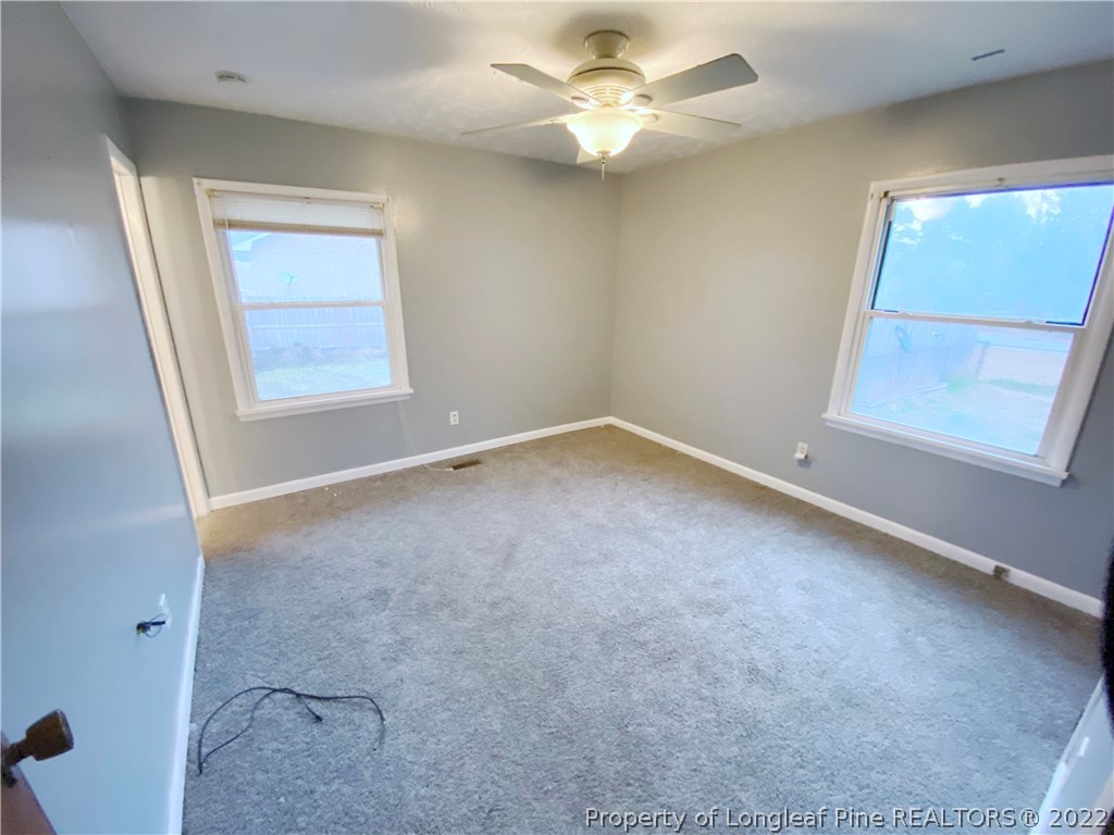 269 Azalea Drive Spring Lake, NC 28390 - Photo 9 of 13 an empty room with a window and a fan