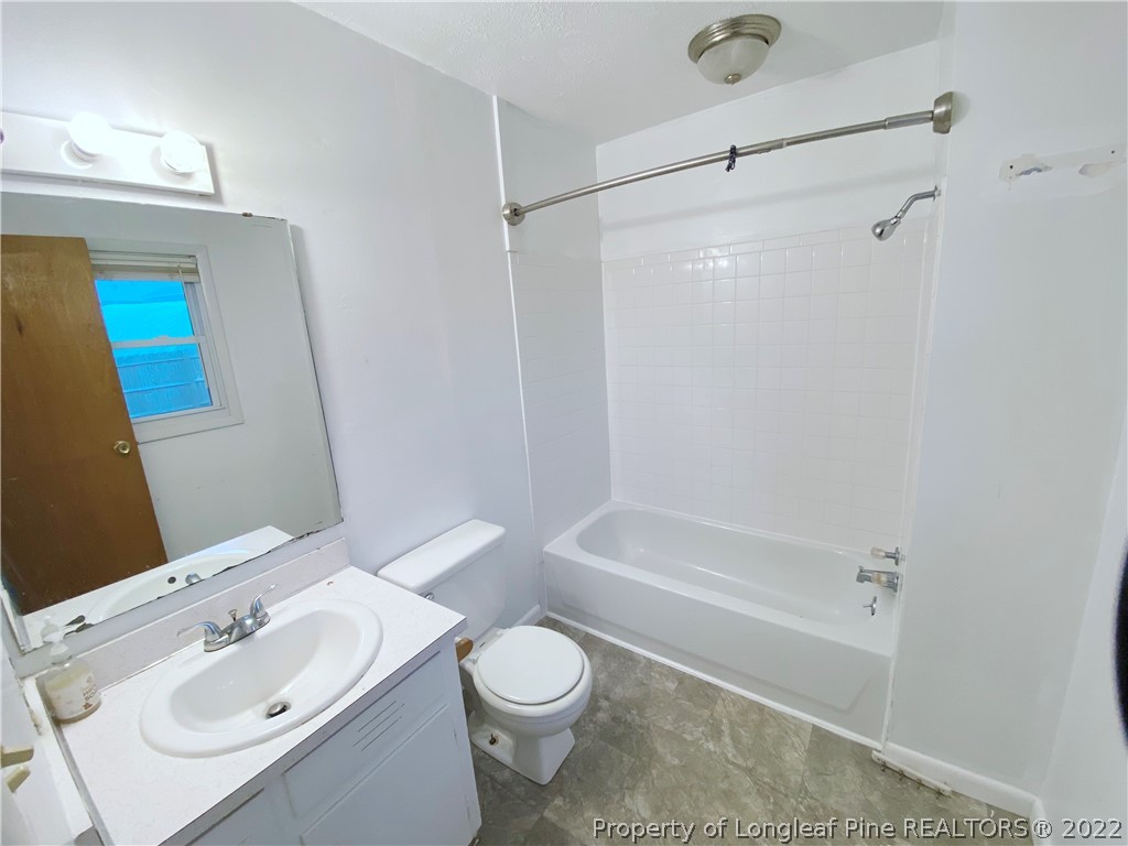 269 Azalea Drive Spring Lake, NC 28390 - Photo 10 of 13 a bathroom with a sink toilet and shower
