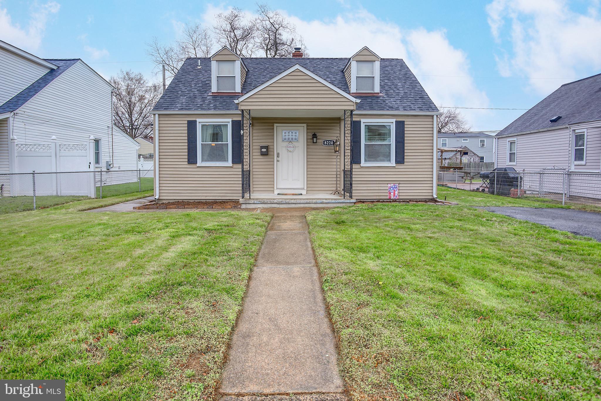 8220 Longpoint Road Dundalk, MD 21222 - Photo 1 of 22 a front view of a house with a yard