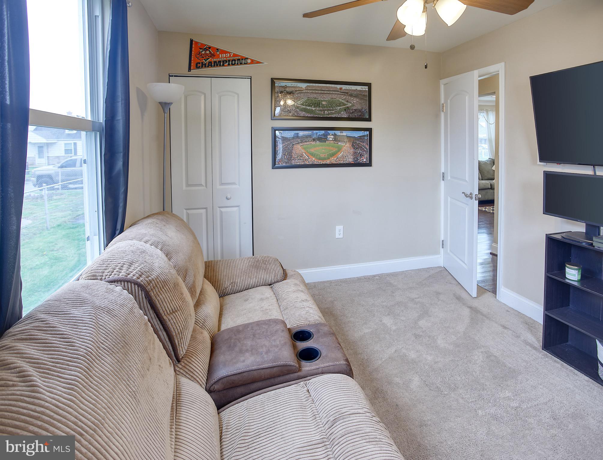 8220 Longpoint Road Dundalk, MD 21222 - Photo 18 of 22 a living room with furniture and a flat screen tv