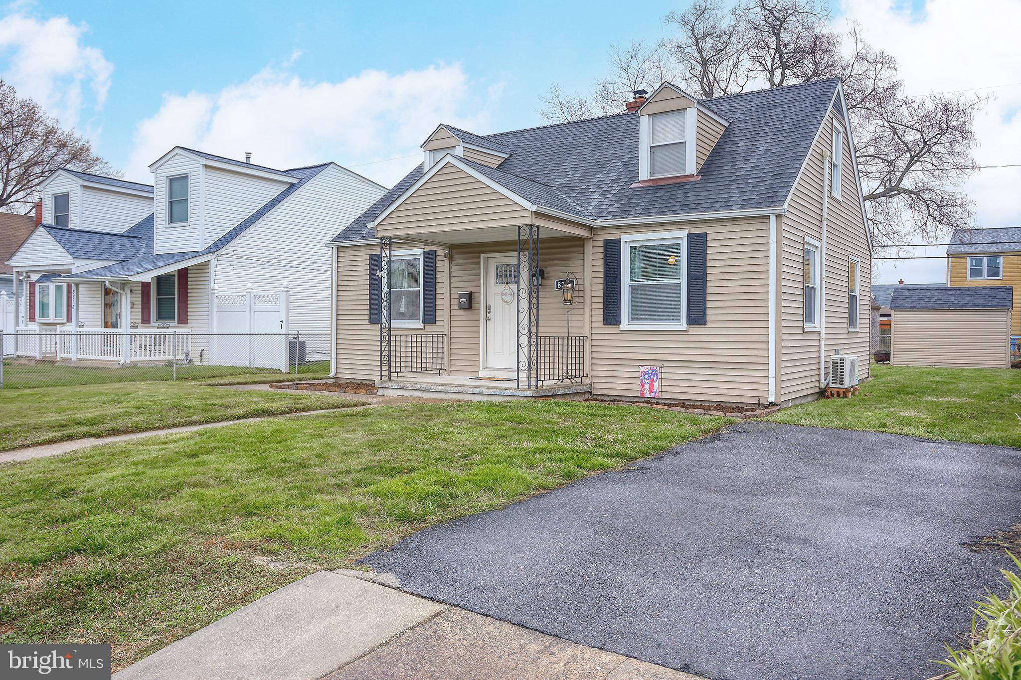8220 Longpoint Road Dundalk, MD 21222 - Photo 2 of 22 a front view of a house with a yard