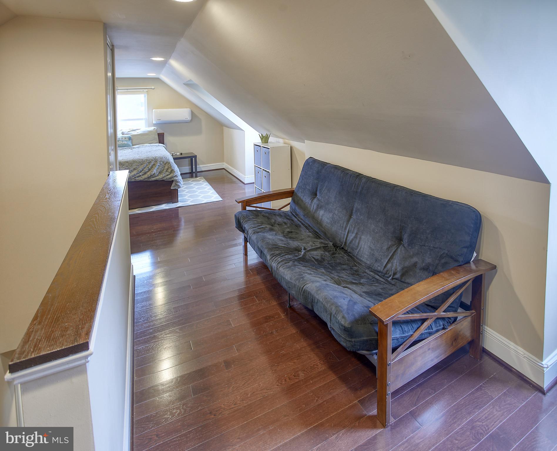 8220 Longpoint Road Dundalk, MD 21222 - Photo 21 of 22 a living room with furniture and wooden floor