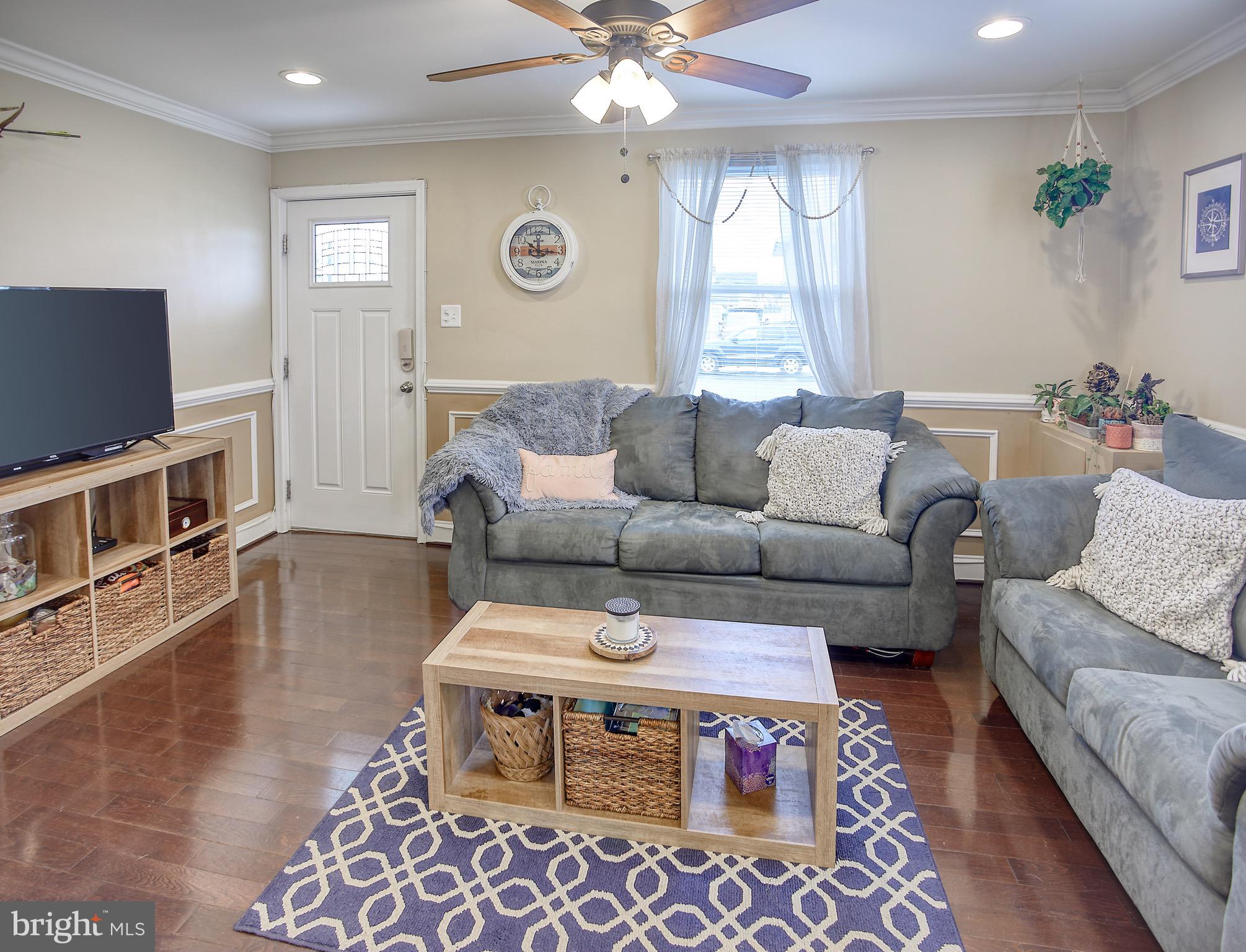 8220 Longpoint Road Dundalk, MD 21222 - Photo 6 of 22 a living room with furniture and a flat screen tv