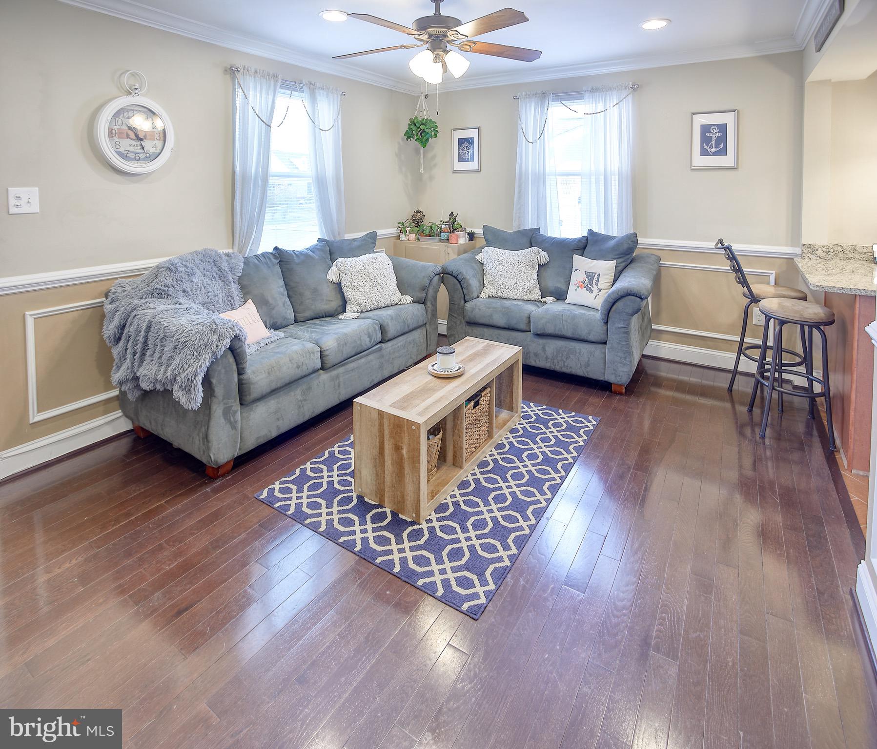 8220 Longpoint Road Dundalk, MD 21222 - Photo 9 of 22 a living room with furniture and a wooden floor