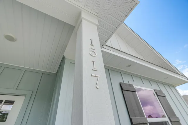a view of staircase with railing and white walls