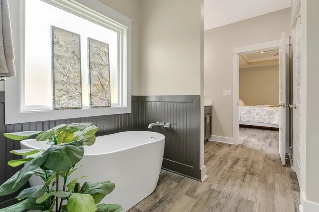 a bathroom with a tub and a sink