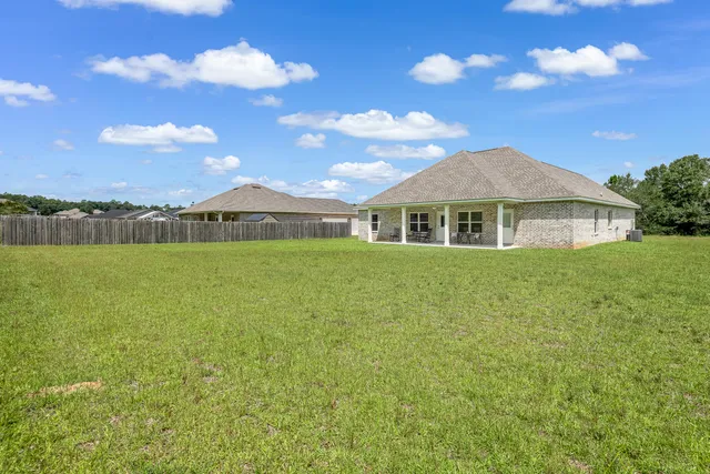 a view of a house with a big yard
