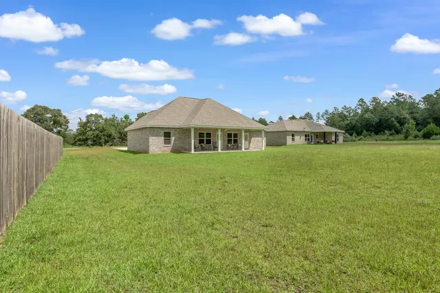 a view of a house with a big yard