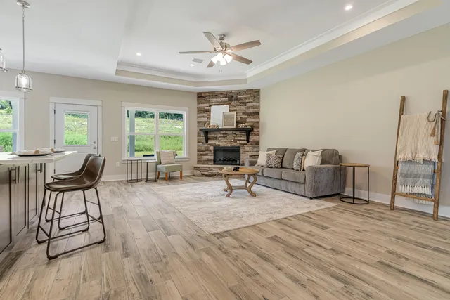 a living room with furniture and a fireplace