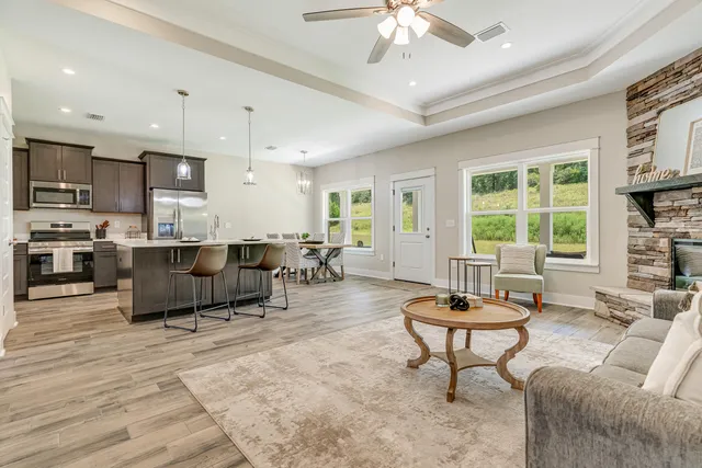 a living room with furniture and a large window