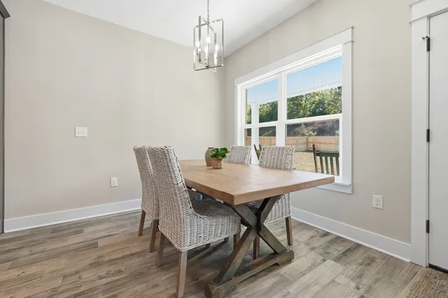 a kitchen with stainless steel appliances kitchen island granite countertop a stove a sink a refrigerator and a microwave