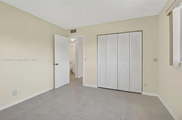 a bathroom with a sink toilet and mirror