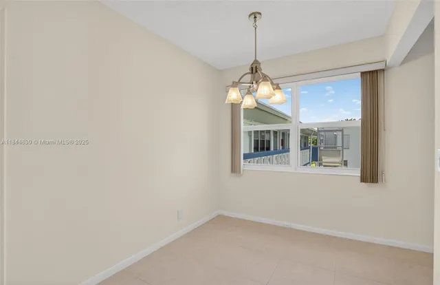 a white refrigerator freezer sitting inside of a kitchen