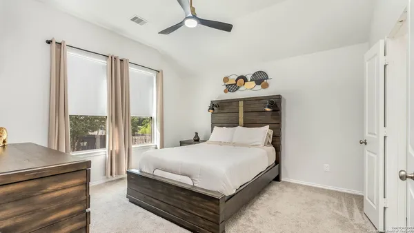 a bathroom with a shower sink and mirror