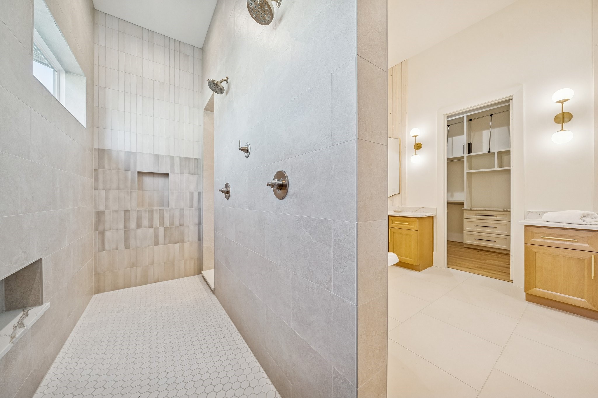 511 Graceland Street Houston, TX 77009 - Photo 25 of 45 Double shower with built-in niches and subtle tile accents.